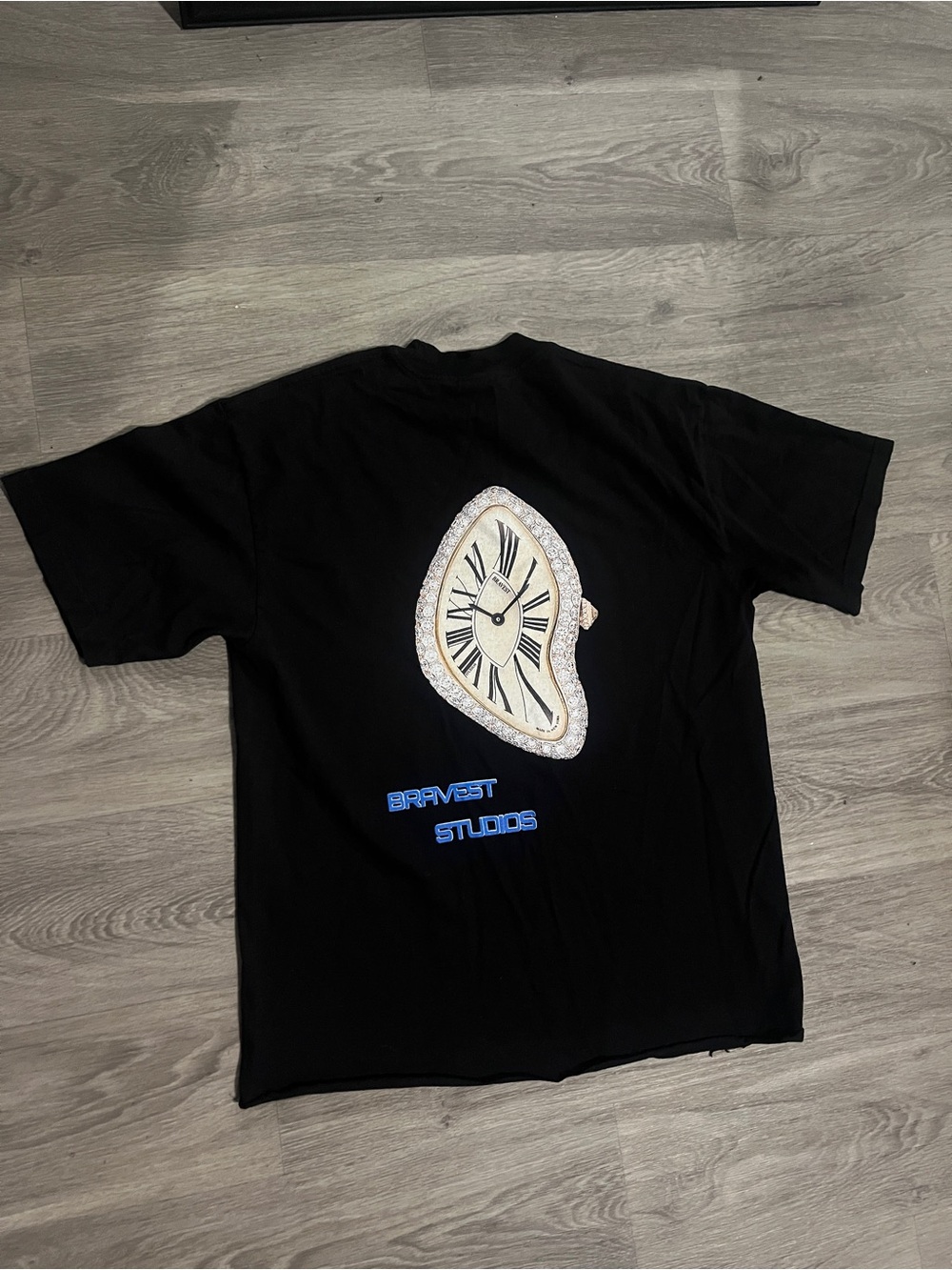 Bravest Studios Black Tee with Melting Clock Graphic